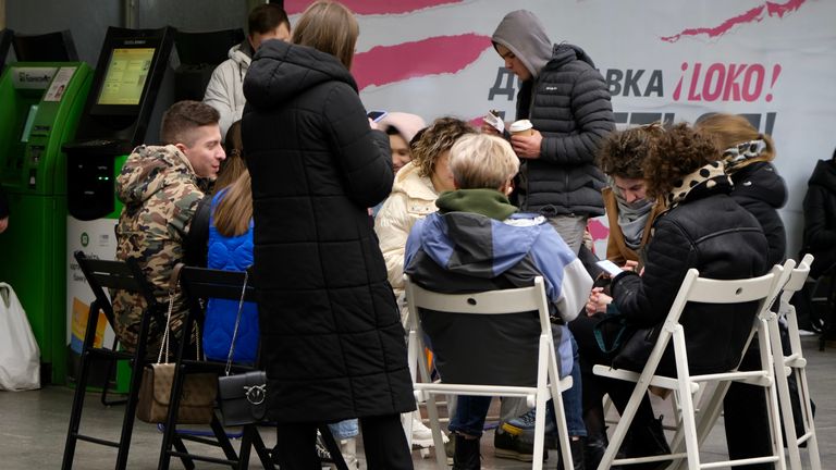 People take shelter in metro station during an alarm