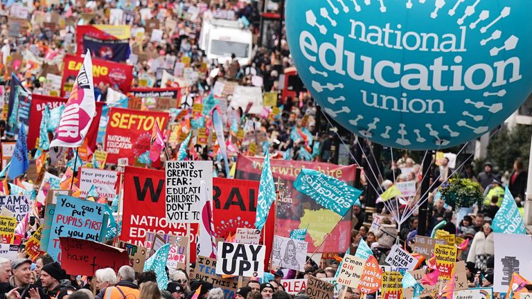 Striking members of the National Education Union (NEU) on Piccadilly march to a rally in Trafalgar Square, central London, in a long-running dispute over pay.  Picture date: Wednesday March 15, 2023.