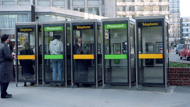 A row of public telephone boxes outside St. Paul&#39;s tube station, City of London. 1999
