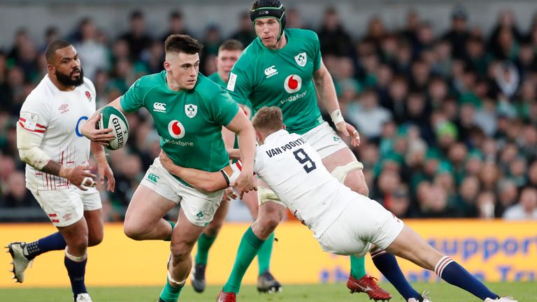 England's Jack van Poortvliet tackles Ireland's Dan Sheehan during the Six Nations rugby union international match between Ireland and England at the Aviva Stadium, in Dublin, Saturday, March 18, 2023. (AP Photo/Peter Morrison)