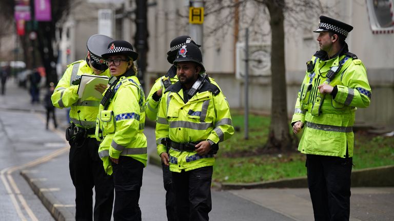 Police officers outside Manchester Crown Court for the trial of Thomas Cashman