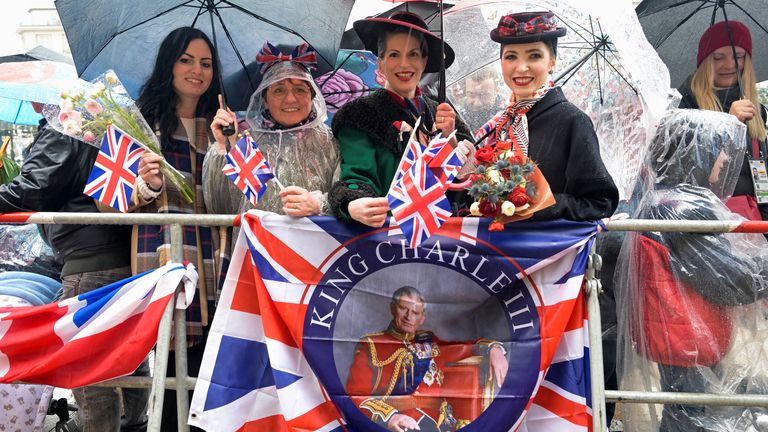 Members of the public wait for  King Charles to visit the town hall, in Hamburg, 