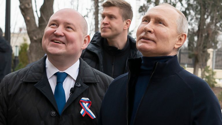 Russian President Vladimir Putin, right, and Sevastopol Governor Mikhail Razvozhayev visit the Children's Center for Arts and Aesthetics, part of the Chersonesos Taurica historical and archaeological park in Sevastopol, Crimea, Saturday, May 18. March 2023. Putin visited Crimea to mark the 9th anniversary of the annexation of the Black Sea peninsula from Ukraine.  (Sputnik, Kremlin Press Service Pool Photo via AP)