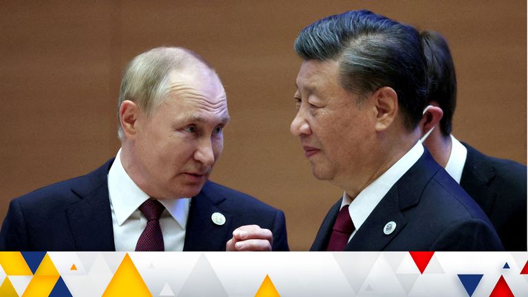 Russian President Vladimir Putin speaks with Chinese President Xi Jinping