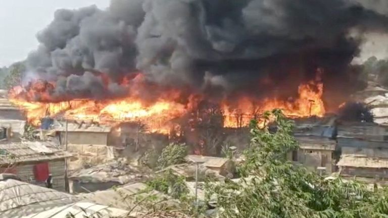 Fire and smoke bellows from burning buildings at Cox&#39;s Bazar refugee camp, Bangladesh March 5, 2023 in this still image obtained from a social media video. Courtesy of Bangladesh Red Crescent Society/via REUTERS THIS IMAGE HAS BEEN SUPPLIED BY A THIRD PARTY. MANDATORY CREDIT. NO RESALES. NO ARCHIVES.