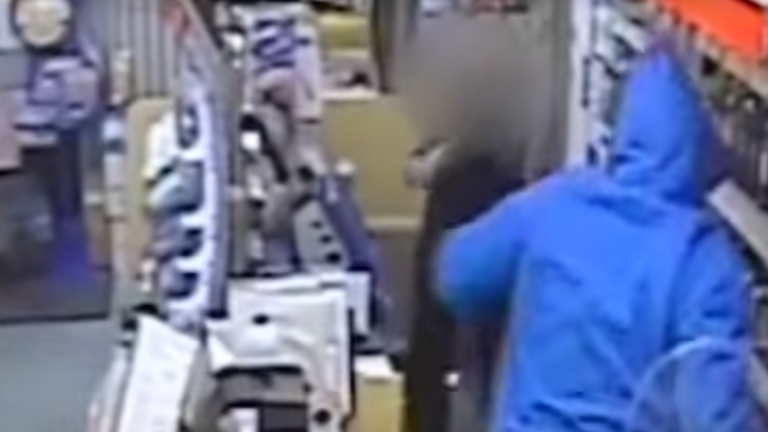Samuel Brown fights a shop worker in an armed robbery. Pic: Sussex Police