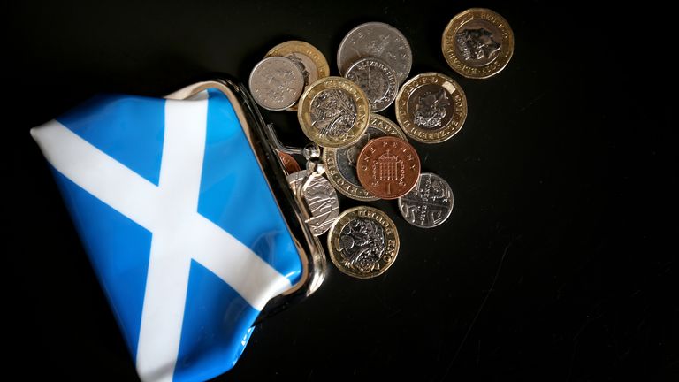 File photo dated 09/04/18 of money and a Scottish purse. Just 13% of Scots believe their community is equipped to deal with the cost-of-living crisis, a new poll has found. The poll, commissioned by Places for People Scotland between February 3 and 6, found that 56% of the 1,199 respondents to the ScotPulse survey did not think their community was thriving. Of these, more than a third (35%) said that a lack of good quality housing was what resulted in their communities not thriving. Issue date: 