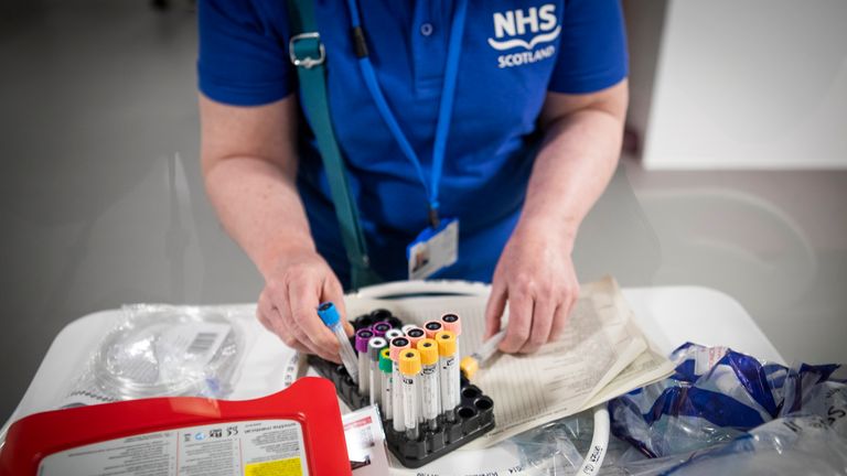 Clinical staff and nurses make final preparations during the completion of the construction of the NHS Louisa Jordan hospital, built at the SEC Centre in Glasgow, to care for coronavirus patients.