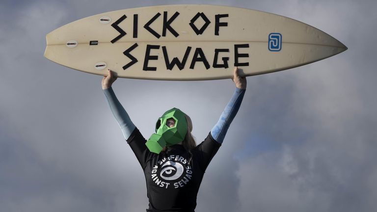 A protest in November 2022 against sewage discharges at an overflow pipe on Long Rock Beach in Penzance, Cornwall