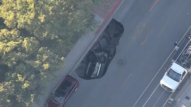 Vehicle is swallowed by sinkhole on California road