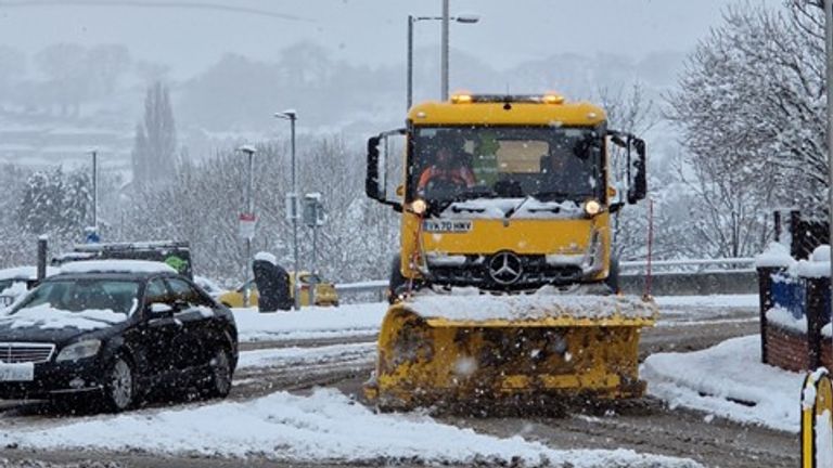 A snow plough clearing the road in Newtown, Powys, as amber weather warning issued for the county.