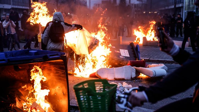 Protesters burn dustbins during a demonstration in Strasbourg Pic: AP 