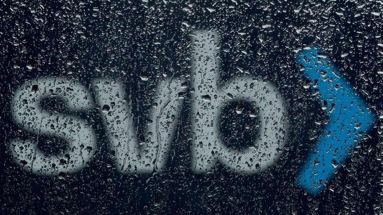 A sign to Silicon Valley Bank is seen through raindrops on a window in Santa Clara, Calif., Friday, March 10, 2023.  The Federal Deposit Insurance Corporation is seizing the assets of Silicon Valley Bank, marking the largest bank failure since Washington Mutual during the height of the 2008 financial crisis. The FDIC ordered the closure of Silicon Valley Bank and immediately took position of all deposits at the bank Friday.(AP Photo/Jeff Chiu)