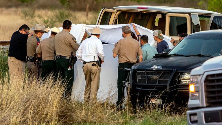 Officials investigate the scene where migrants were found trapped in a train car, Friday, March 24, 2023. Pic:AP