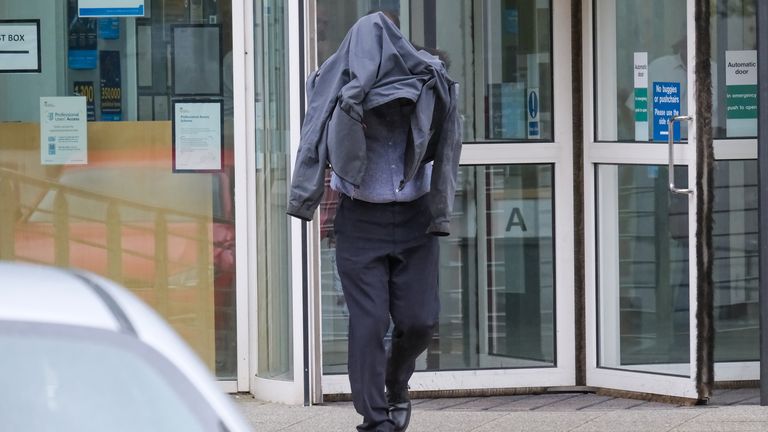 Civilian police worker Timothy Schofield, the brother of TV presenter Phillip Schofield, covers his head as he leaves Exeter Crown Court where he is on trial accused of sexual abuse of a teenager. Schofield, 54, is accused of 11 charges of interfering with a child which started when the victim was just a teenager. Picture date: Thursday March 30, 2023.
