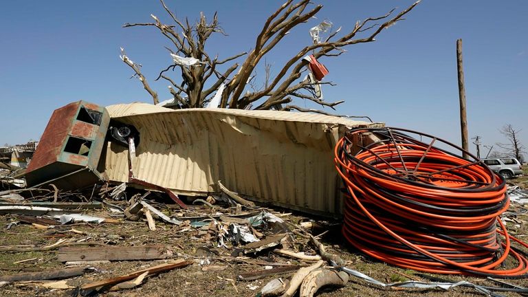 A shipping container sits next to a tornado-shattered tree at Rolling Fork.Image; Associated Press