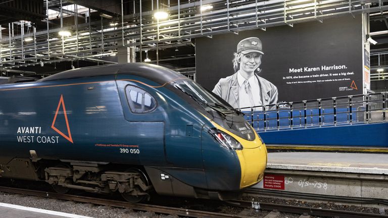 An Avanti West Coast train pulls up next to a new mural at Euston Station 