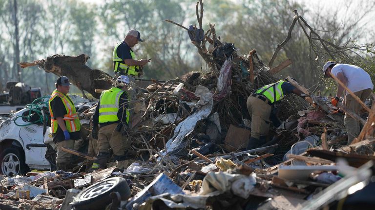 Emergency rescuers climb through a tornado-demolished mobile home park looking for bodies that might be buried in the piles of debris in Rolling Fork. Pic: AP
