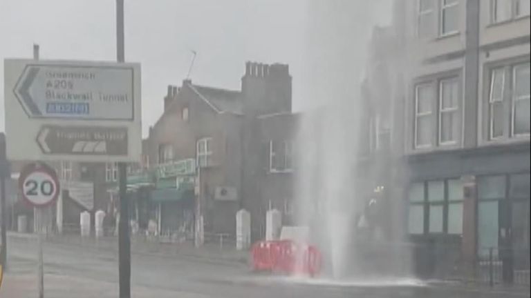 Water seen spraying out of road in Woolwich