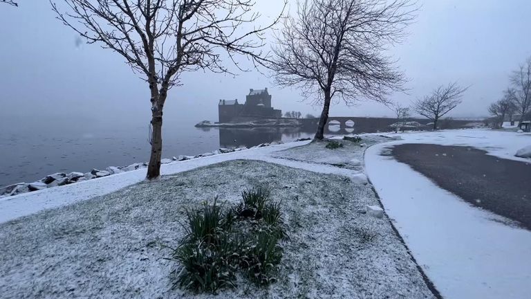 Snow and ice cover Eilean Donan Castle in Scotland