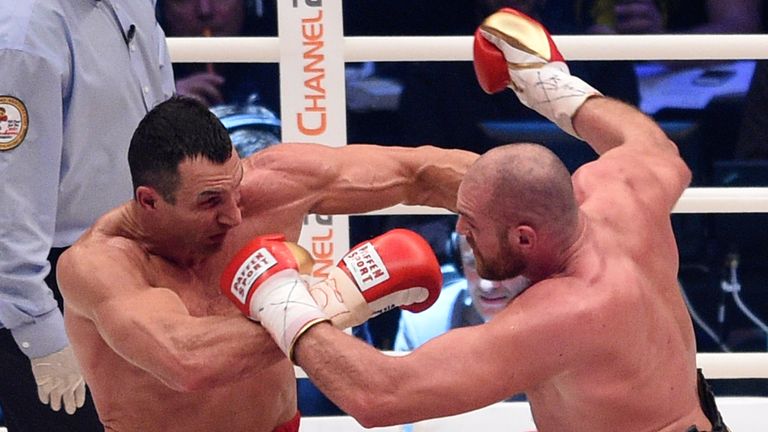 Ukraine&#39;s Wladimir Klitschko, left, and Britain&#39;s Tyson Fury exchange blows in a world heavyweight title fight for Klitschko&#39;s WBA, IBF, WBO and IBO belts in the Esprit Arena in Duesseldorf, western Germany, Saturday, Nov. 28, 2015. (AP Photo/Sebastian Konopka)


