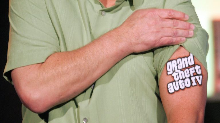 Peter Moore, Microsoft's vice president of interactive entertainment, showed off a tattoo on his arm to announce the game "grand theft auto iv" The Xbox 360 system will be available on October 17, 2006 as he speaks to the audience at the Microsoft Xbox 360 2006 E3 media event on May 9, 2006 in Hollywood. Reuters/Fred Prouser