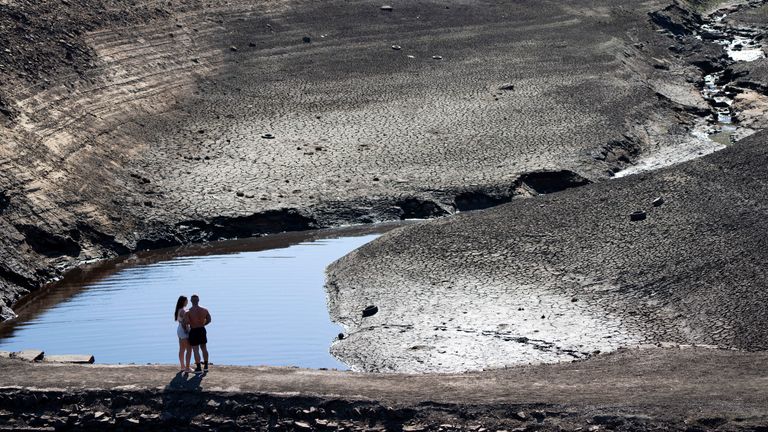 Facts - Ripponden, England, record high, August 2018 A couple stands on the low-water exposed old packhorse bridge at Baitings Reservoir, Yorkshire.  December 12, 2022. The widespread drought that dried up much of Europe, the US and China last summer is 20 times more likely to occur due to climate change, a new study suggests.Photo: Associated Press