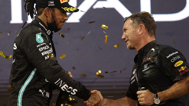 Sir Lewis Hamilton and Christian Horner pictured after the end of the 2021 Formula 1 season
