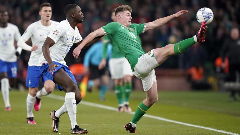 Republic of Ireland&#39;s Evan Ferguson attempts to control the ball under pressure from France&#39;s Ibrahima Konate