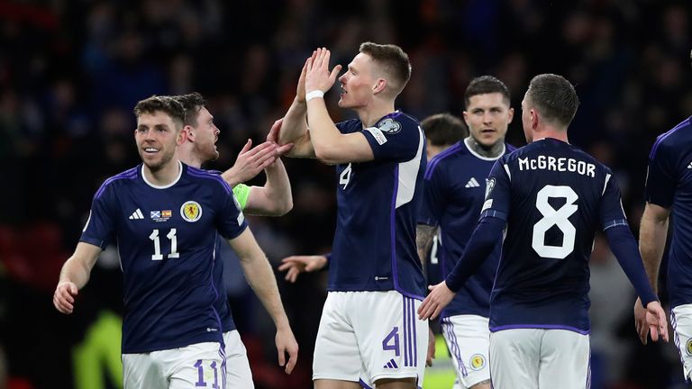 Scotland&#39;s Scott McTominay, third from left, celebrates with his teammates after scoring his side&#39;s second goal during the Euro 2024 group A qualifying soccer match between Scotland and Spain at the Hampden Park stadium in Glasgow, Scotland, Tuesday, March 28, 2023. (AP Photo/Scott Heppell)