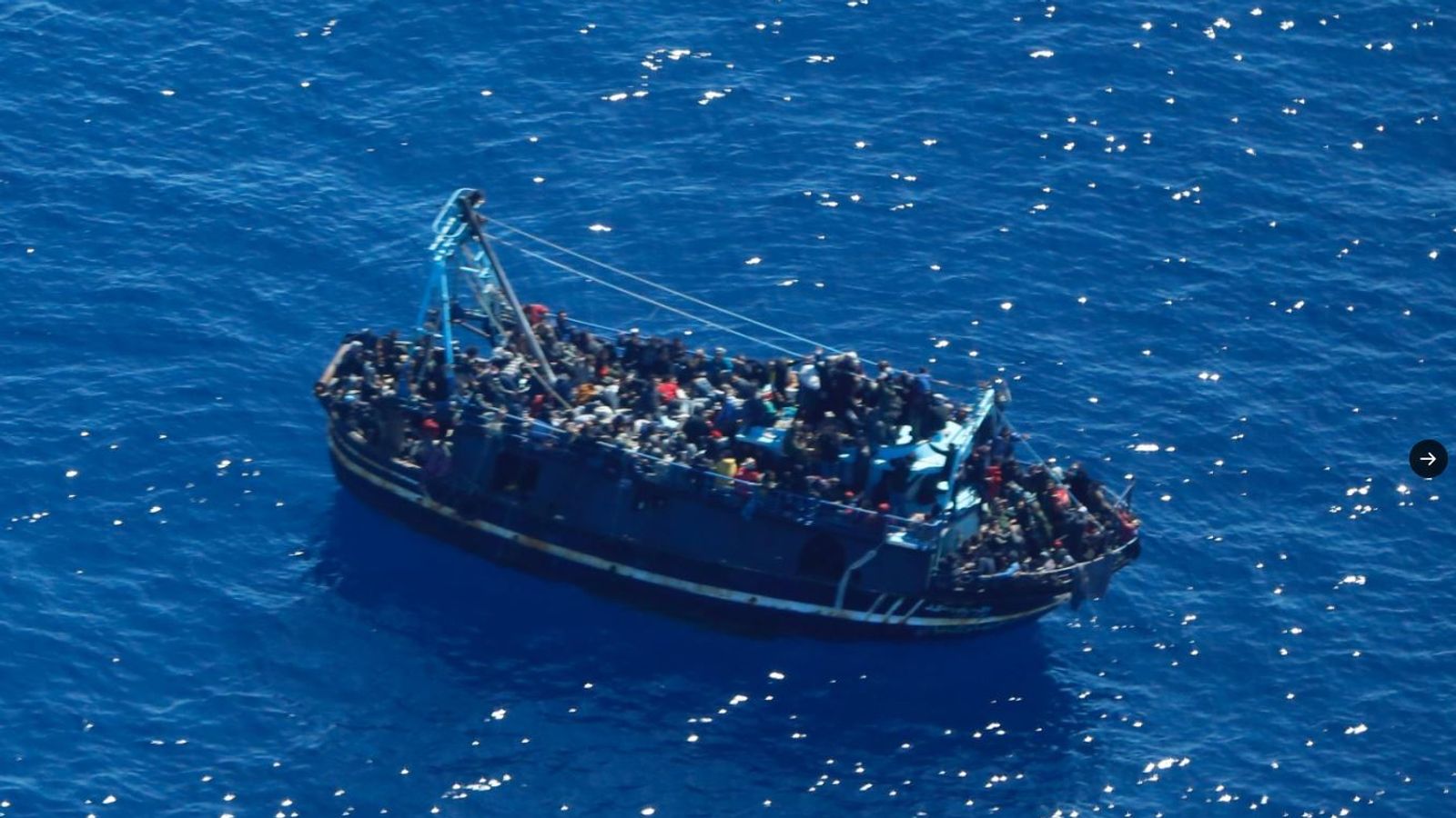 Boat between Greece and Malta carrying about 400 'people in distress' is 'taking on water'