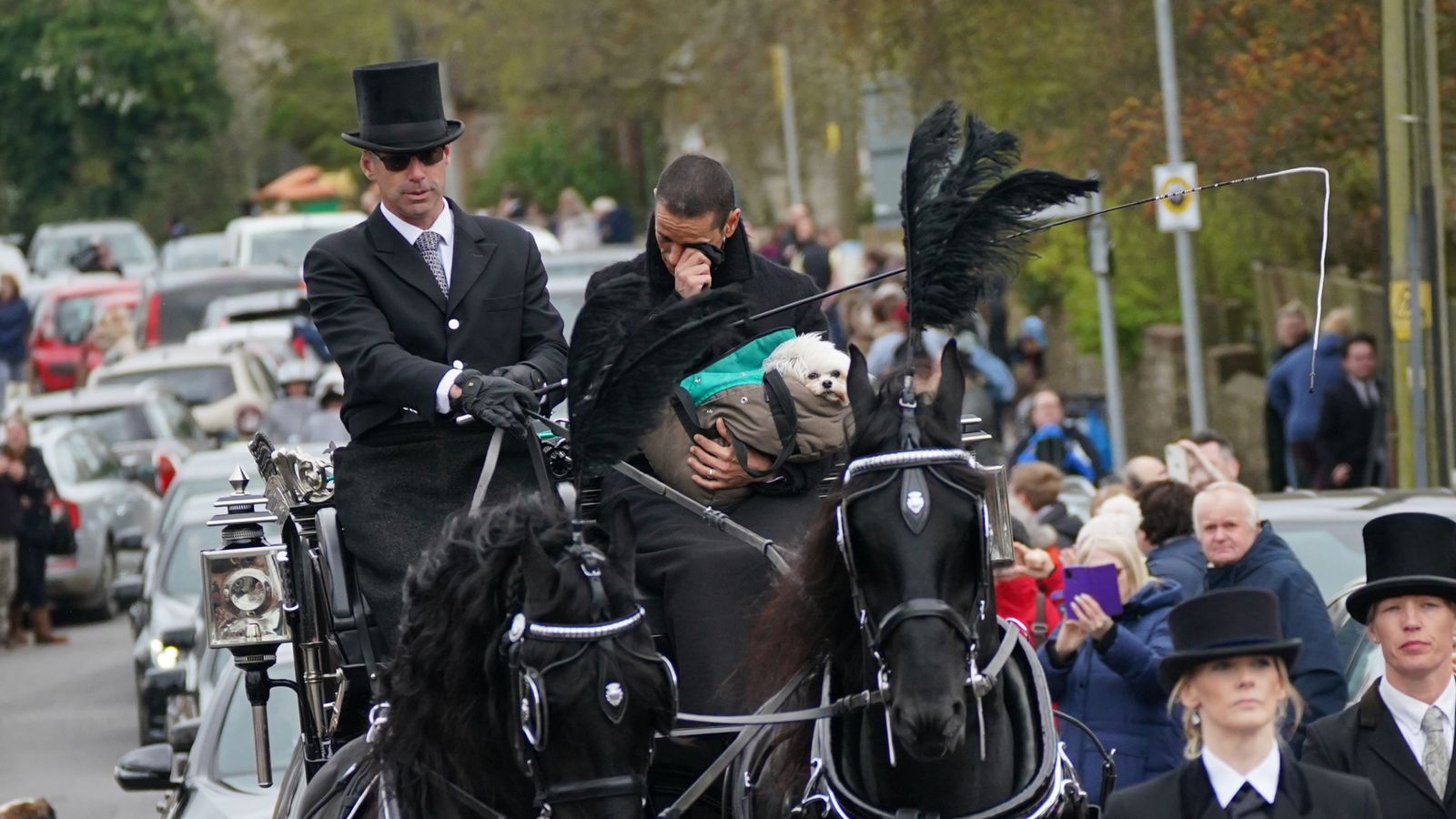 Celebrities attend Paul O'Grady's funeral as dogs line the streets