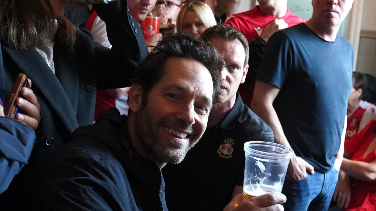 Wrexham: Hollywood star Paul Rudd drinks beer and sings with fans ahead ...