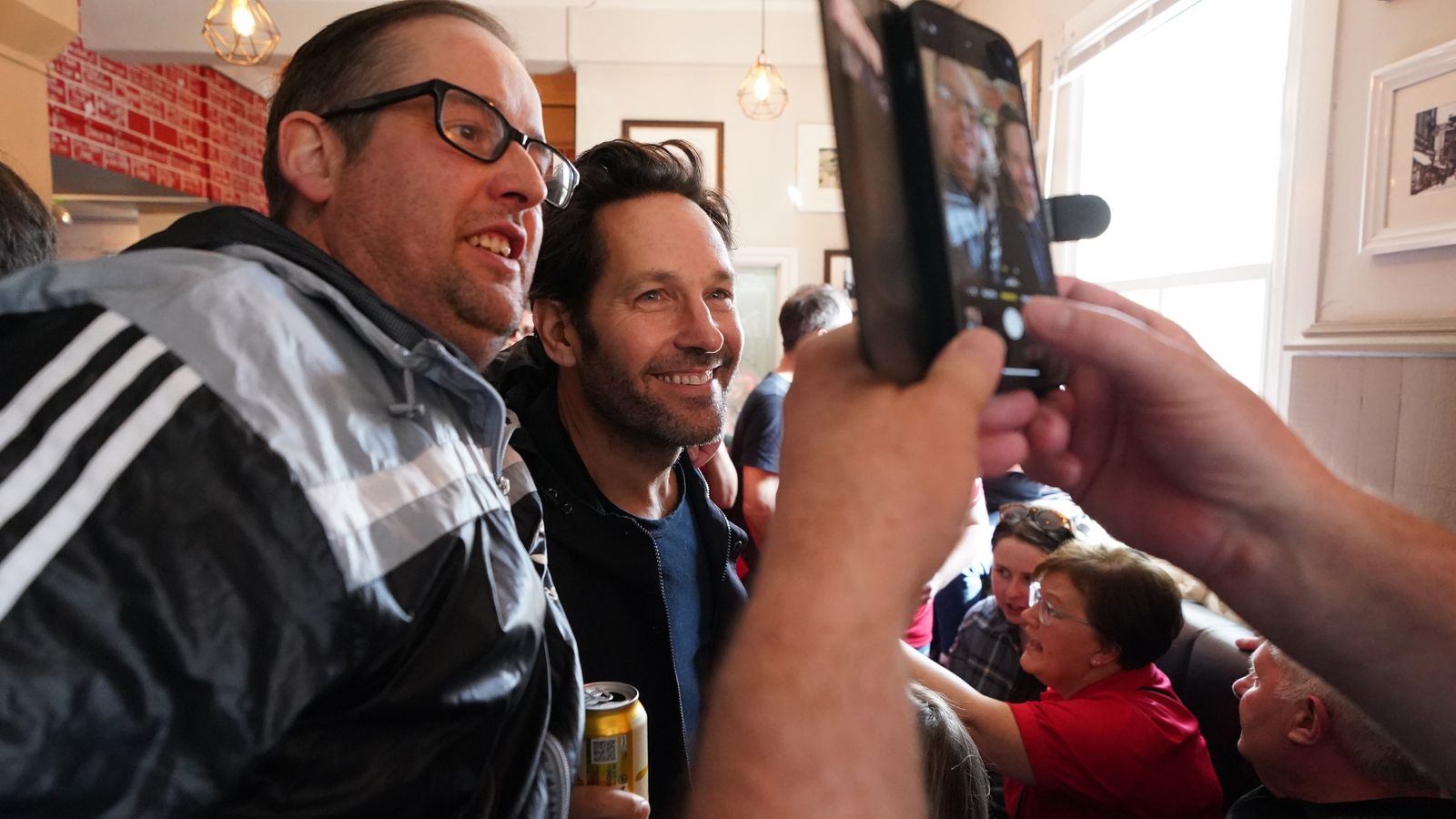 Wrexham: Hollywood star Paul Rudd drinks beer and sings with fans ahead of crunch National League match 