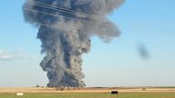 Smoke rises at the Southfork Dairy Farms, after an explosion and a fire killed around 18,000 cows, near Dimmitt, Texas