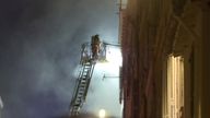 A firefighter at one of the collapsed buildings in Marseille. Pic: BFMTV via Reuters