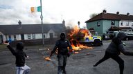 Members of nationalist group 'Dissident Republicans' throw petrol bombs at a police car as nationalists hold an anti-agreement rally on the 25th anniversary of the peace deal, in Londonderry, Northern Ireland, April 10, 2023. REUTERS/Clodagh Kilcoyne