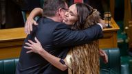 Jacinda Ardern, right, is hugged by Finance Minister Grant Robertson after Ardern made her final speech to New Zealand&#39;s Parliament in Wellington 
Pic:New Zealand Herald/AP