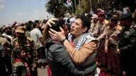 Houthi prisoners are greeted as they arrive to Sanaa airport, Friday, April 14, 2023
