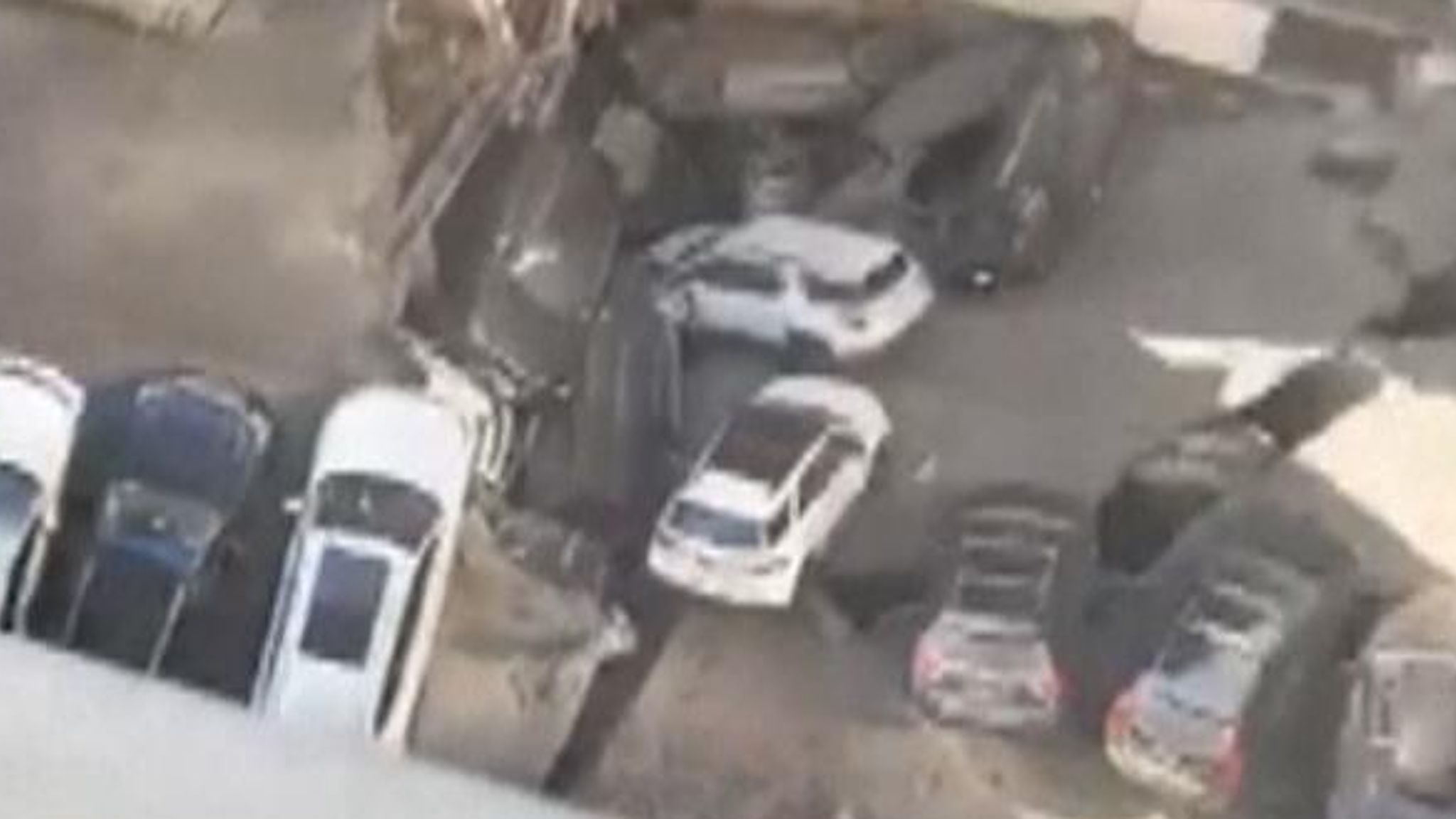 Witnesses film the aftermath of a building collapse in Manhattan where one car park floor fell on to another