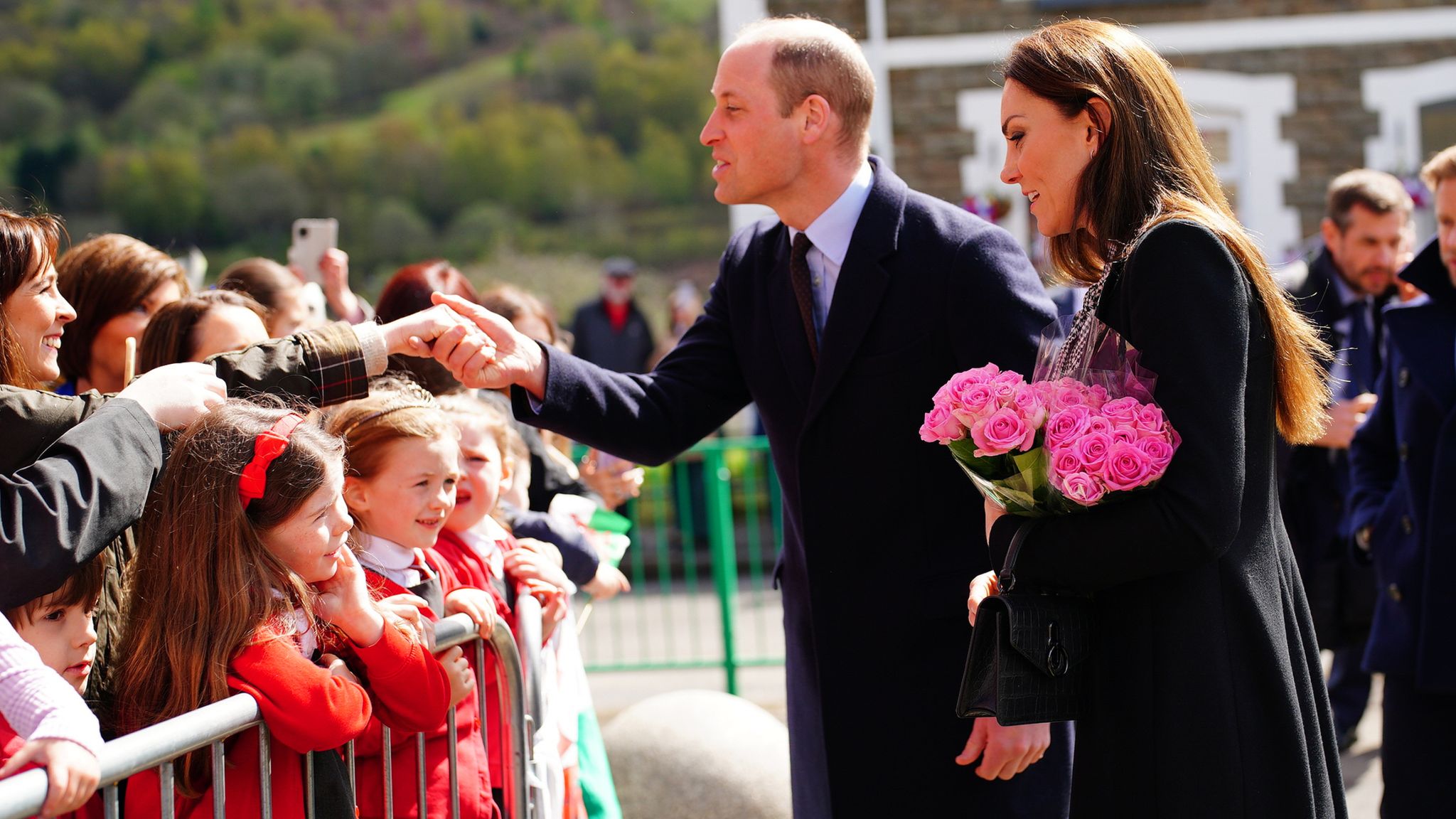 Kate Middleton in black for Aberfan; Adorable baby swipes her bag!