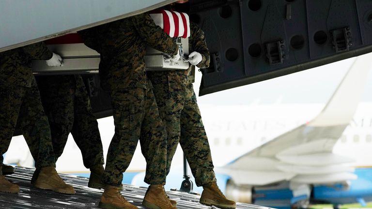 Case with the remains of Marine Corps Staff Sgt. Darin T. Hoover is carried at Dover Air Force Based in Delaware. Pic: AP