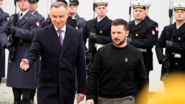Poland&#39;s President Andrzej Duda, left, welcomes Ukrainian President Volodymyr Zelenskyy as they meet at the Presidential Palace in Warsaw, Poland 
Pic:AP