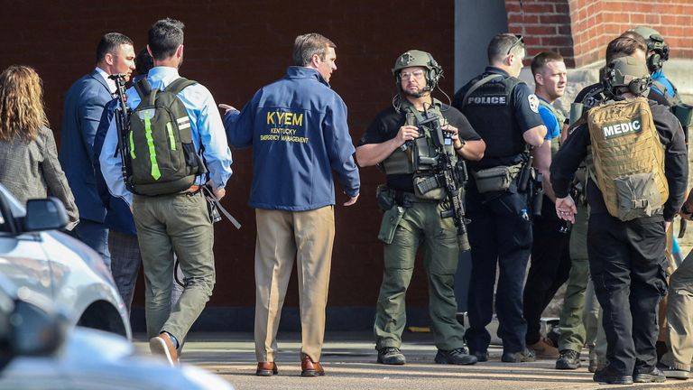 Kentucky Governor Andy Beshear speaks with police deploying at the scene of a mass shooting near Slugger Field baseball stadium in downtown Louisville, Kentucky Pic:USA Today Network /Reuters