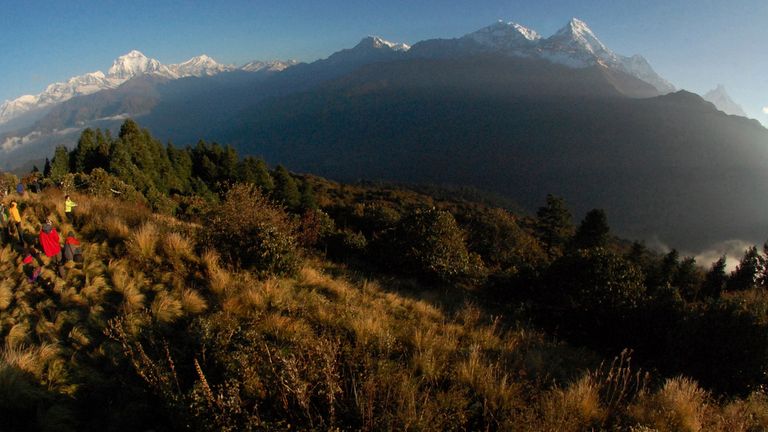 People seen watching the sunrise over the Annapurna mountain range in Nepal in 2014 File pic: AP  