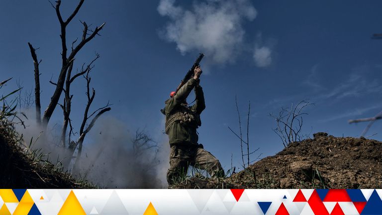 A Ukrainian soldier fires a grenade launcher on the frontline in Bakhmut, Donetsk region, Ukraine, Monday, April 10, 2023. (AP Photo/Libkos)