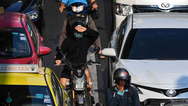 Sweltering temperatures in Bangkok made it difficult for drivers and bike riders