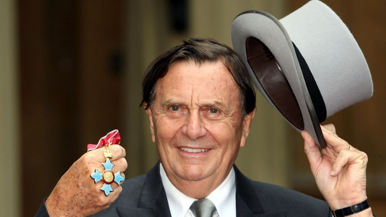 Australian entertainer Barry Humphries poses for pictures after he received his Most Excellent Order of the British Empire from Britain&#39;s Queen Elizabeth II at Buckingham Palace, London, Wednesday, Oct. 10, 2007. (AP Photo/Steve Parsons/pool)