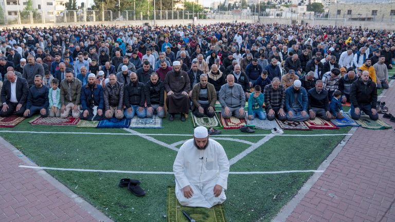 Palestinian Muslims perform Eid al-Fitr prayers at a soccer court, in the West Bank city of Beitunia 
Pic:AP
