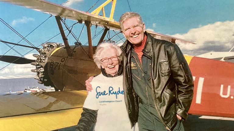 Betty Bromage pictured with the pilot for her first wing walk - and below, working as a young nurse